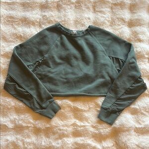 Alo Yoga Green Cropped Sweatshirt with open back and mesh lining in sleeves